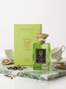 Teacup overflowing with a dynamic splash of rich black tea and fresh mint leaves
