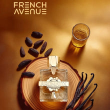 Aromatix perfume bottle on wood slice with vanilla beans, tonka beans, and a glass of amber liquid.