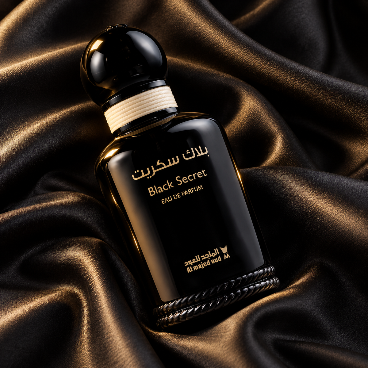 Overhead diagonal view of Black Secret Eau de Parfum bottle on black satin