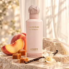 Candy Musk EDT bottle in soft light with peach slices, caramel and vanilla