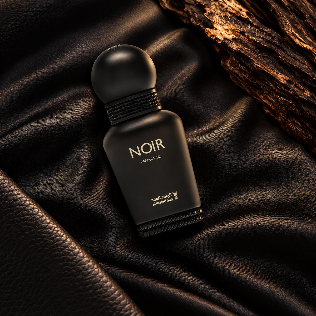 Overhead Noir Perfume Oil 15ml black bottle on satin with leather and guaiac wood