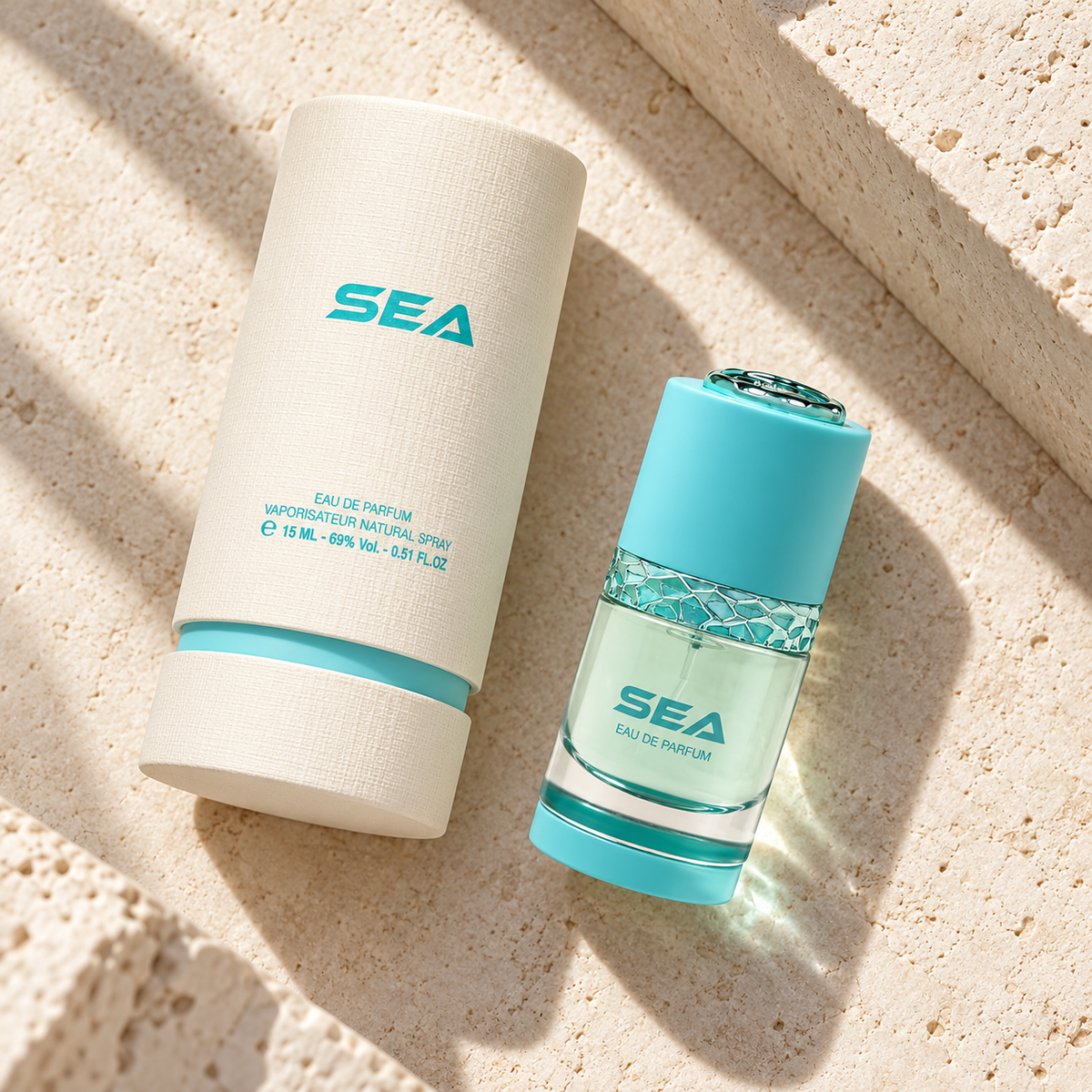 Al Majed Oud Sea 15ml bottle and presentation tube photographed overhead on limestone