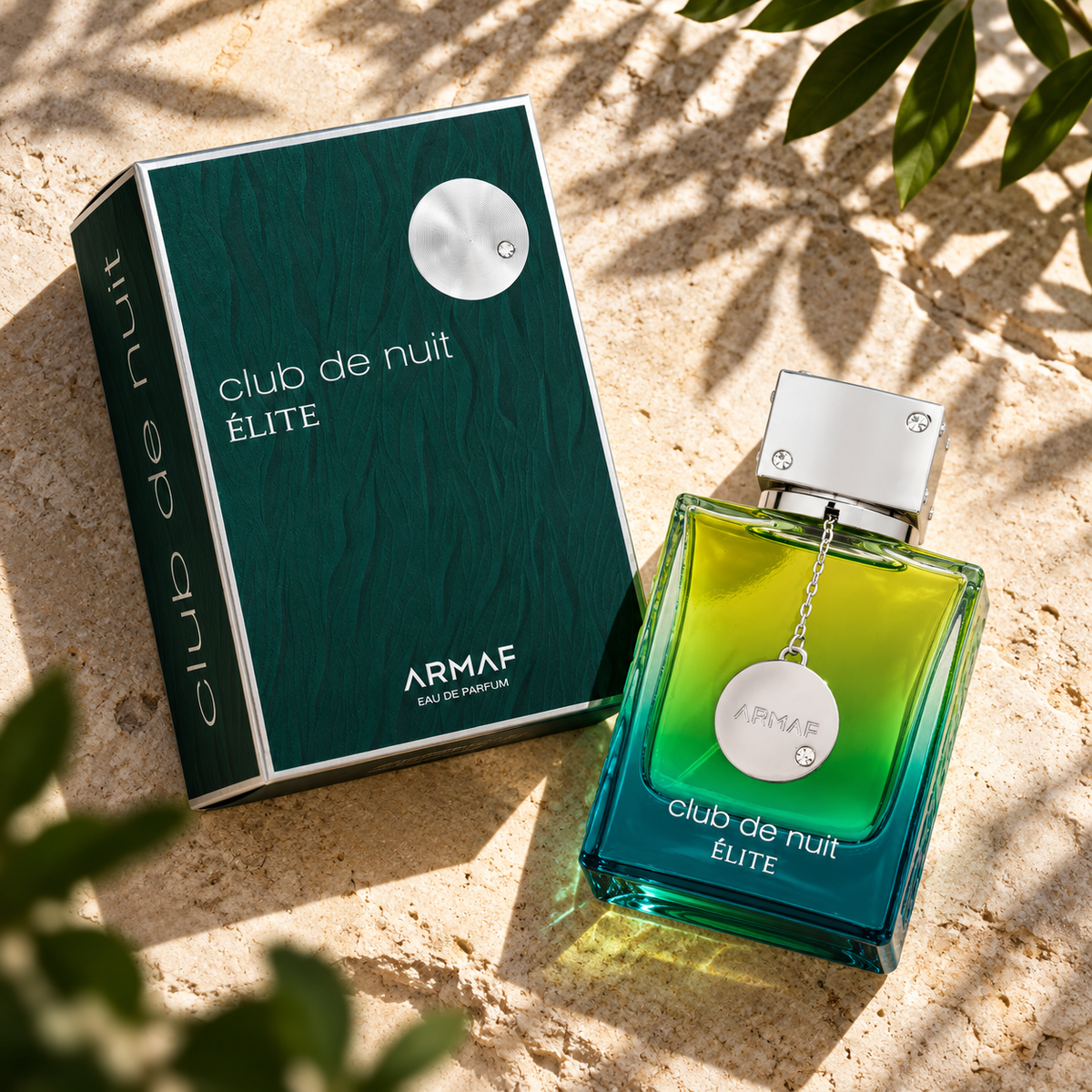 Armaf Club de Nuit Elite EDP 105ml bottle and original box photographed overhead on limestone