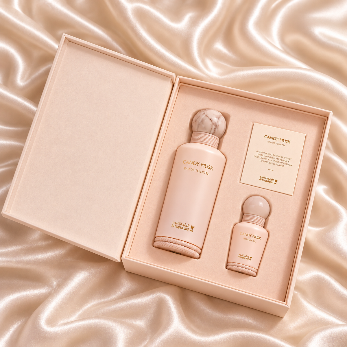 Overhead view of Candy Musk 150ml EDT and 15ml perfume oil in their original open fitted gift box