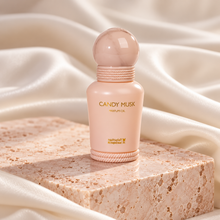 Candy Musk 15ml perfume oil bottle on blush travertine with ivory silk