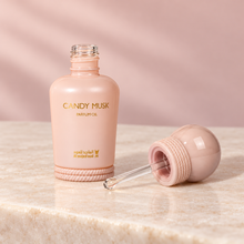 Candy Musk 15ml perfume oil uncapped with the original clear dabber wand attached to its spherical cap