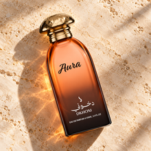 DKHONI Aura 100ml Eau de Parfum — overhead bottle composition