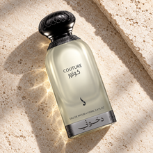 DKHONI Couture 100ml Eau de Parfum — overhead bottle composition