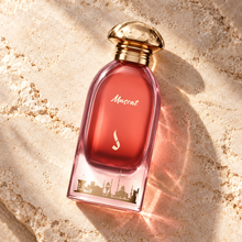 DKHONI Muscat 100ml Eau de Parfum — overhead bottle composition