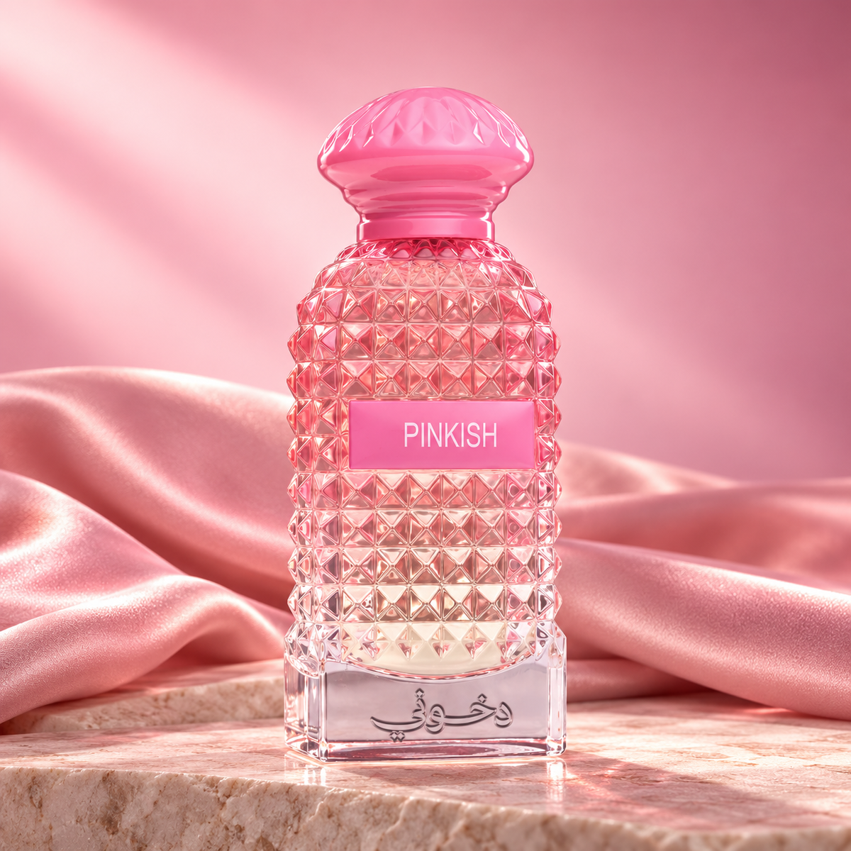 DKHONI Pinkish 100ml Eau de Parfum — bottle on a premium studio set