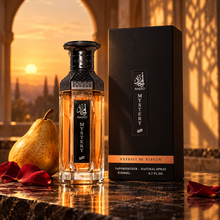 Amjad Mystery bottle and box with pear and rose petals in warm evening light