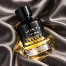 Fragrance World Invicto Intense 100ml bottle in an overhead silk composition