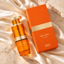 Papa Yeah! Extradose 100ml bottle and orange box in an overhead composition on ivory silk