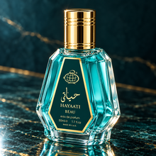 Hayaati Beau 50ml bottle from a three-quarter angle on dark teal stone