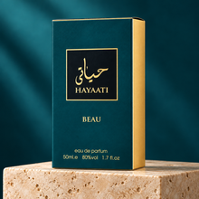 Hayaati Beau 50ml original teal and gold box on a travertine plinth