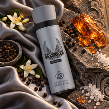 Overhead Invicto Intense capped grey spray can on silver silk with orange blossom pepper amber and salt