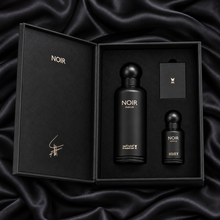 Overhead view of Noir 150ml Parfum and 15ml perfume oil in their original open black fitted gift box