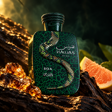 Rasasi Hawas Boa EDP 100ml bottle in golden cinematic light with pomelo resin and driftwood