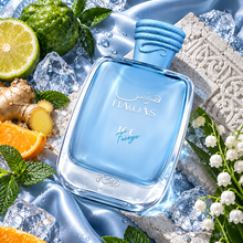 Overhead Hawas Ice Freeze bottle on blue silk and carved pale stone with citrus and mint