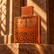Rayhaan Vantage orange geometric bottle on sunlit travertine
