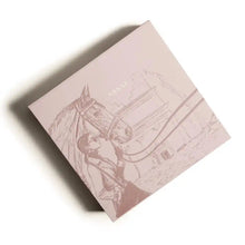 Elegant pink box featuring embossed horse and rider design, labeled 'ASSAF' — luxury Arabian oud perfume packaging