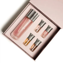 Luxury Arabian oud perfume gift set with elegant bottles in a pink box