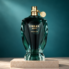 Urban Man Amaze faceted teal perfume bottle on an ivory plinth